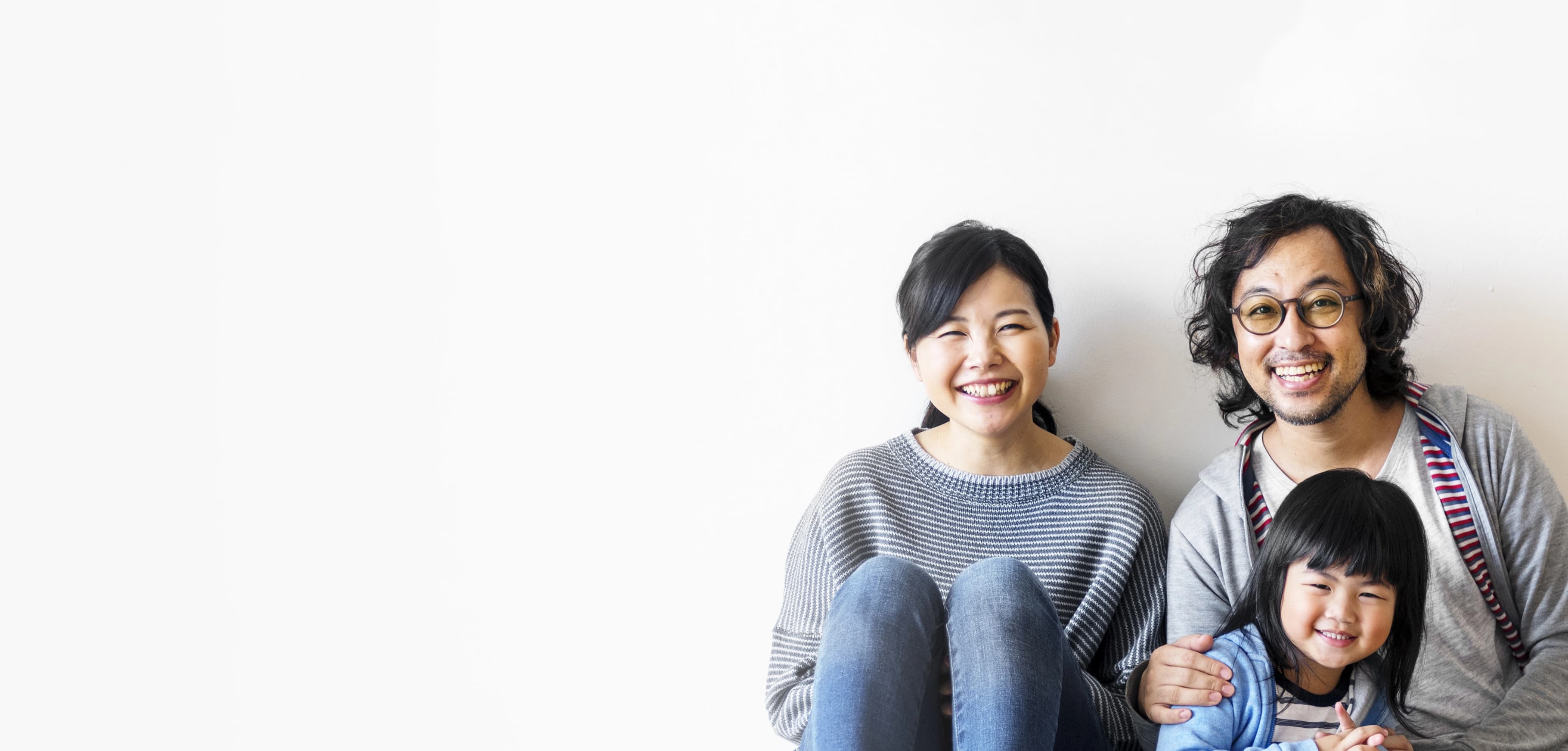 hero image of a family of three