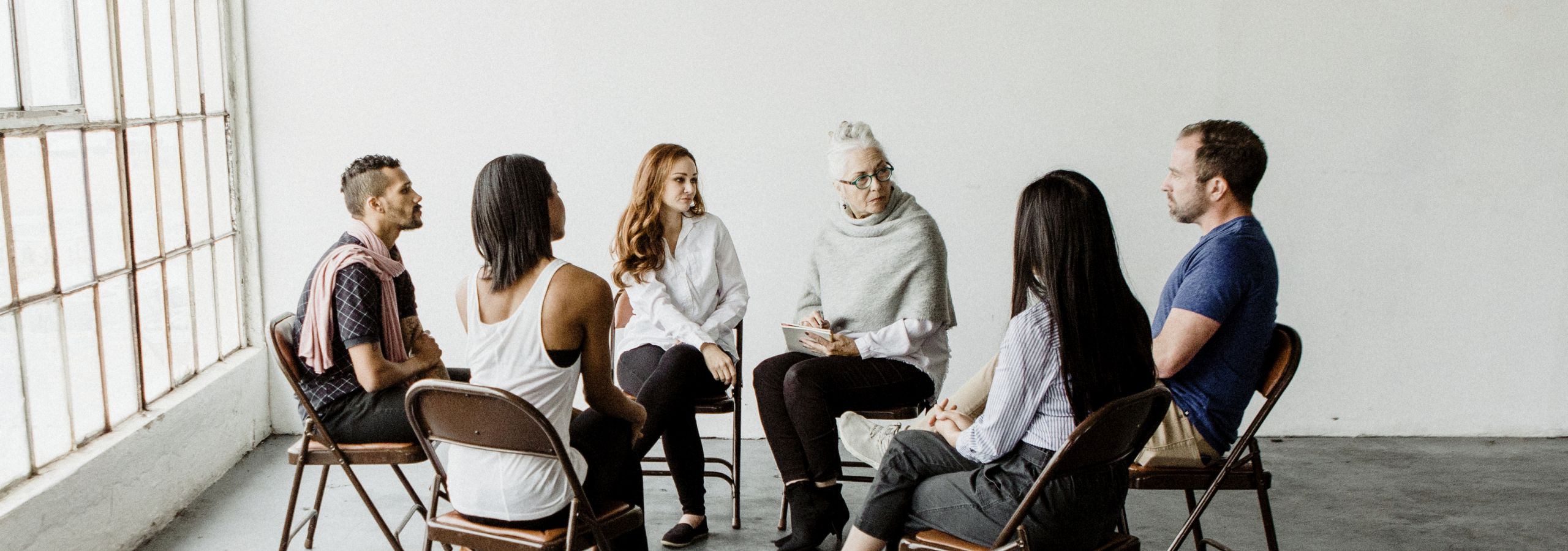 people sitting in a circle talking